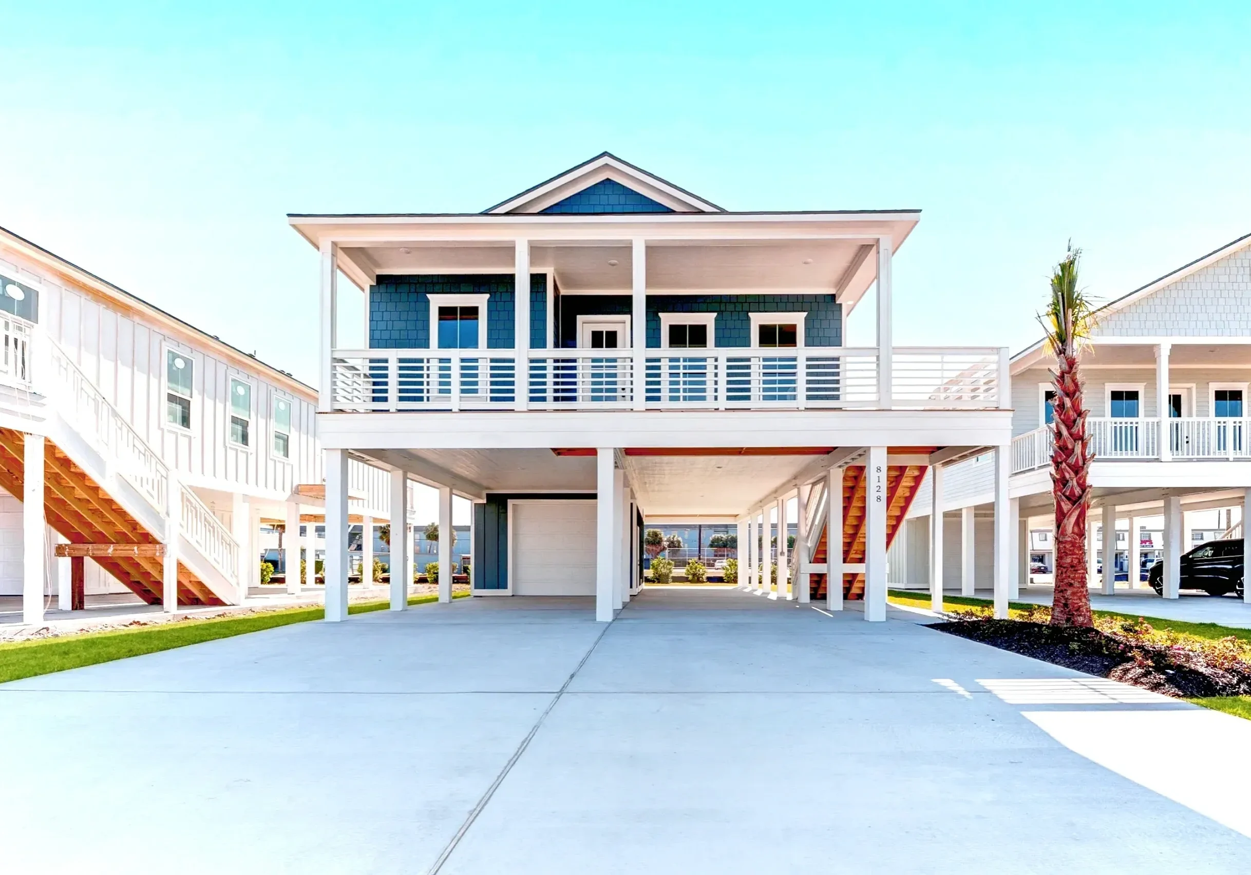 Elevated beach house with spacious driveway.